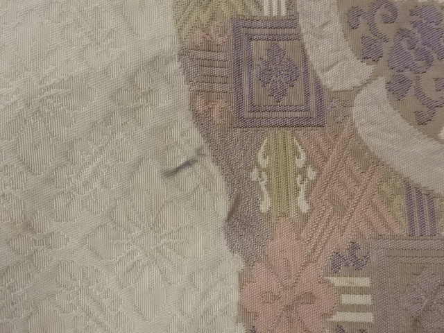  変わり華文に幾何学模様織出し袋帯